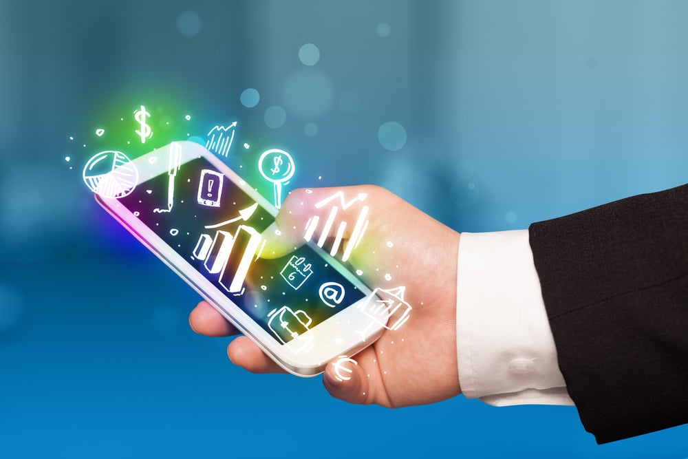 Smartphone with finance and market icons and symbols concept